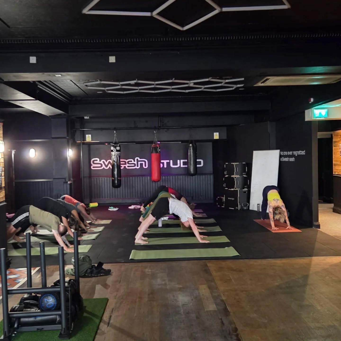 A yoga and movement class on the Swesh Studio floor